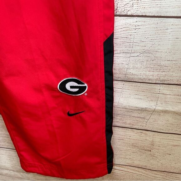 VINTAGE NIKE UNIVERSITY OF‎ GA TRACK PANTS IN RED - Picture 4 of 7